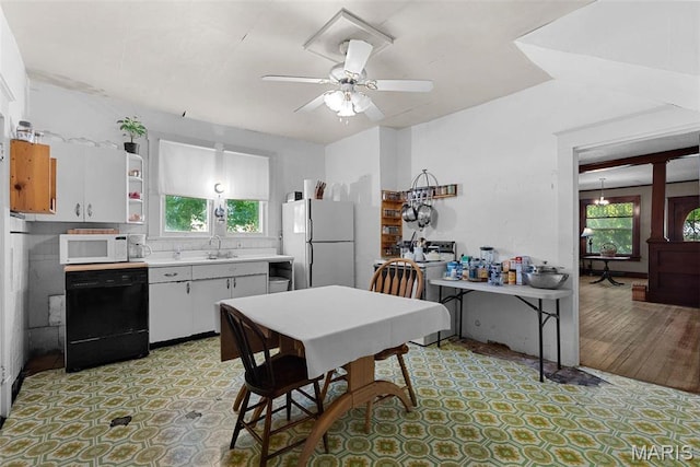 302 E Walsh St, Montgomery City, MO 63361 - kitchen with white appliances, light countertops, a ceiling fan, a sink, and open shelves