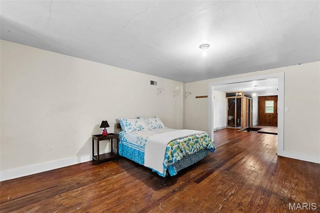 302 E Walsh St, Montgomery City, MO 63361 - bedroom featuring hardwood / wood-style flooring and baseboards