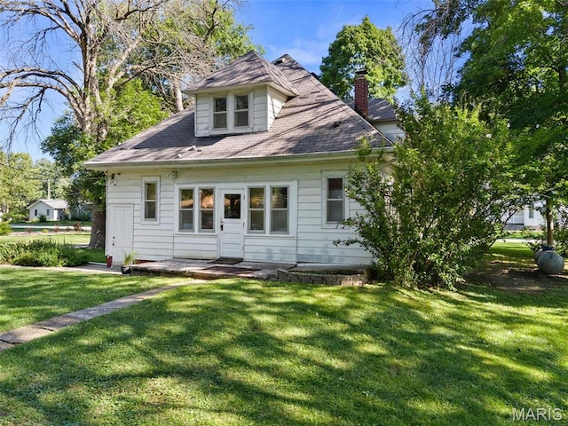 302 E Walsh St, Montgomery City, MO 63361 - rear view of property featuring a yard and a chimney