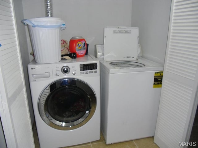 116 Wilson Park Ln, Granite City, IL 62040 - laundry room with separate washer and dryer and light tile patterned floors