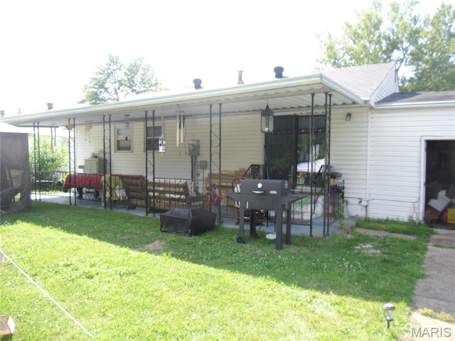 116 Wilson Park Ln, Granite City, IL 62040 - back of house featuring a yard and a patio