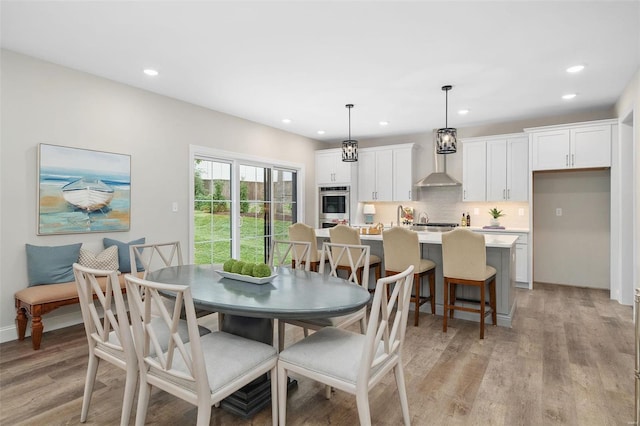 8817 Moritz Ave, Saint Louis, MO 63144 - dining area with light wood-style floors and recessed lighting
