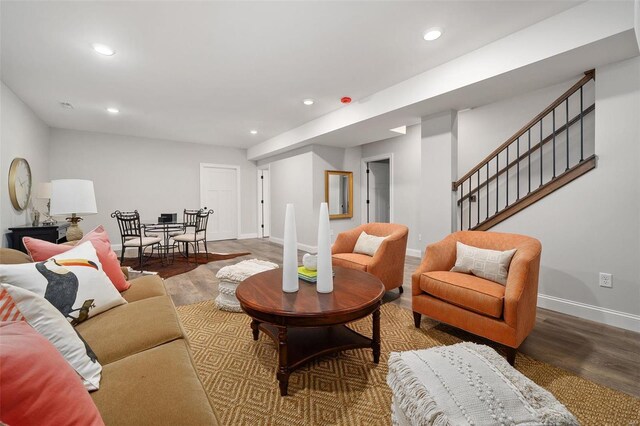 8817 Moritz Ave, Saint Louis, MO 63144 - living area featuring wood finished floors, recessed lighting, baseboards, and stairs