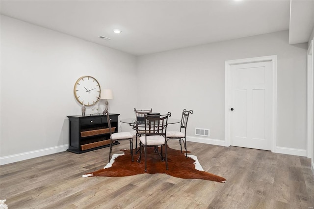 8817 Moritz Ave, Saint Louis, MO 63144 - dining area with wood finished floors, baseboards, and recessed lighting