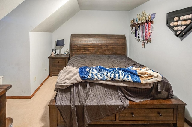 bedroom with carpet flooring and vaulted ceiling