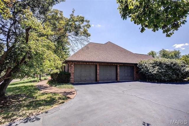 6 Red Fox Rd, Belleville, IL 62223 - view of side of property with an attached garage, brick siding, a shingled roof, and driveway