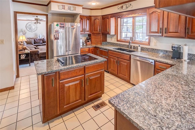 6 Red Fox Rd, Belleville, IL 62223 - kitchen with stainless steel appliances, a sink, ornamental molding, light tile patterned flooring, and brown cabinetry