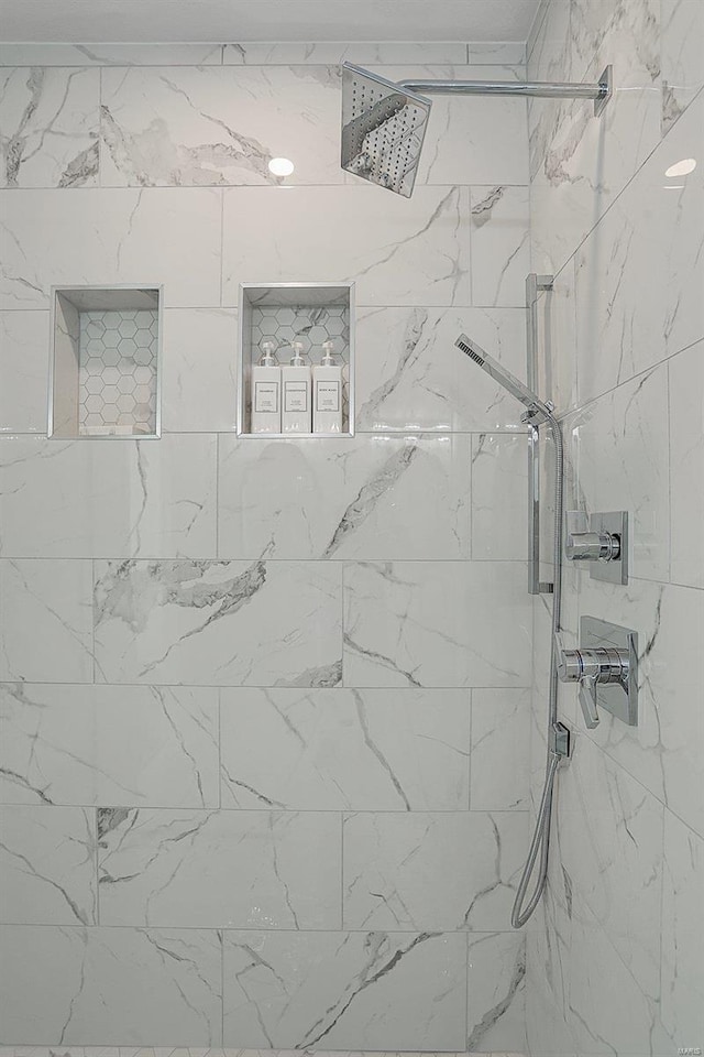 full bath featuring a tile shower