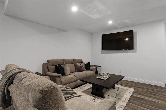 living room with baseboards, wood finished floors, and recessed lighting
