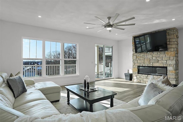 310 Captains Ct, Grafton, IL 62037 - living room featuring recessed lighting, a ceiling fan, wood finished floors, a fireplace, and baseboards