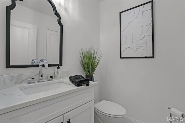 310 Captains Ct, Grafton, IL 62037 - half bath featuring vanity, toilet, and baseboards
