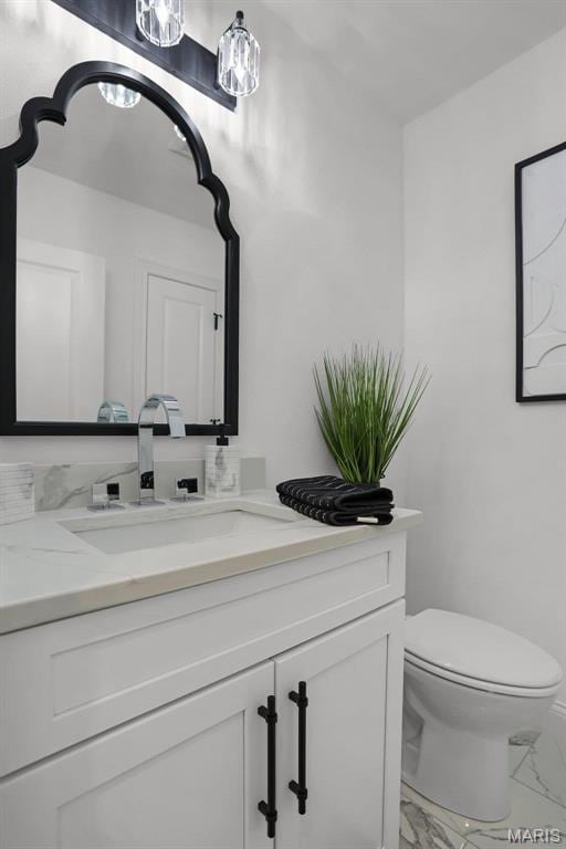 310 Captains Ct, Grafton, IL 62037 - bathroom featuring marble finish floors, vanity, and toilet