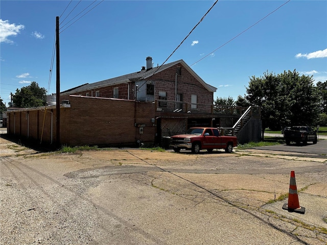 156 S Main St, Ironton, MO 63650 - view of home's exterior featuring brick siding and stairway