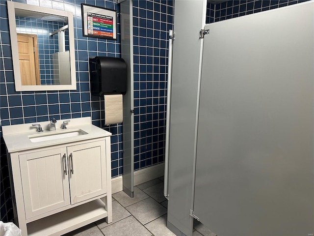 156 S Main St, Ironton, MO 63650 - bathroom with tile patterned floors, tile walls, vanity, and a shower