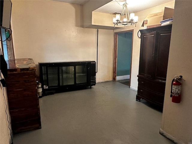 156 S Main St, Ironton, MO 63650 - interior space with a chandelier, concrete flooring, and baseboards