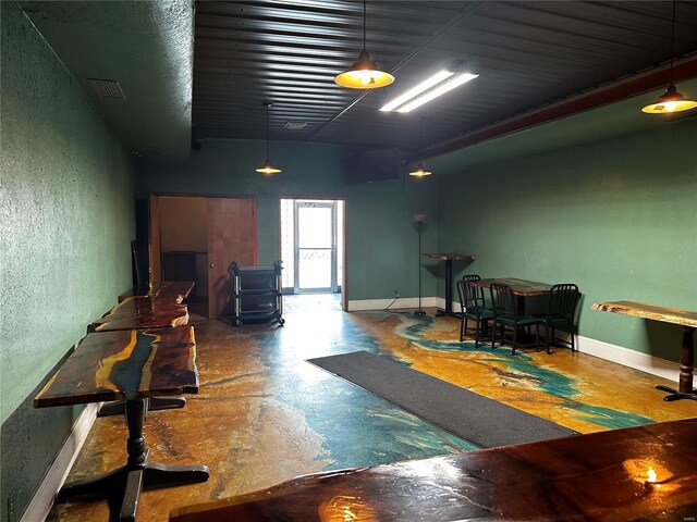 156 S Main St, Ironton, MO 63650 - living room with concrete floors and a textured wall
