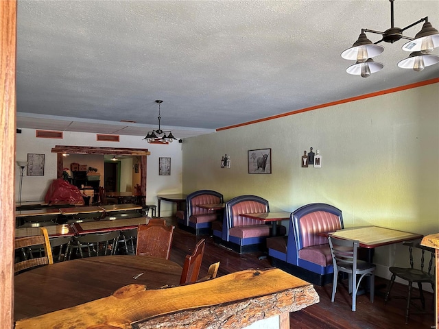 156 S Main St, Ironton, MO 63650 - dining room featuring a textured ceiling, wood finished floors, and crown molding