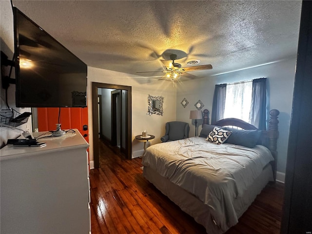 156 S Main St, Ironton, MO 63650 - bedroom featuring a textured ceiling, wood-type flooring, baseboards, and a ceiling fan