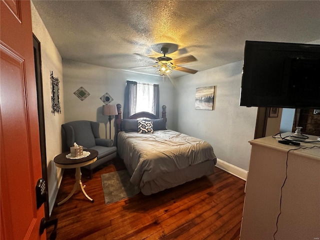 156 S Main St, Ironton, MO 63650 - bedroom with dark wood finished floors, a textured ceiling, baseboards, and ceiling fan