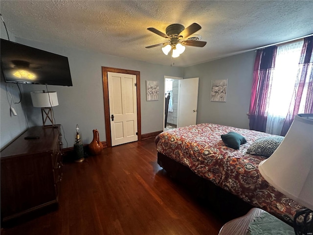 156 S Main St, Ironton, MO 63650 - bedroom with dark wood finished floors, a textured ceiling, baseboards, and a ceiling fan