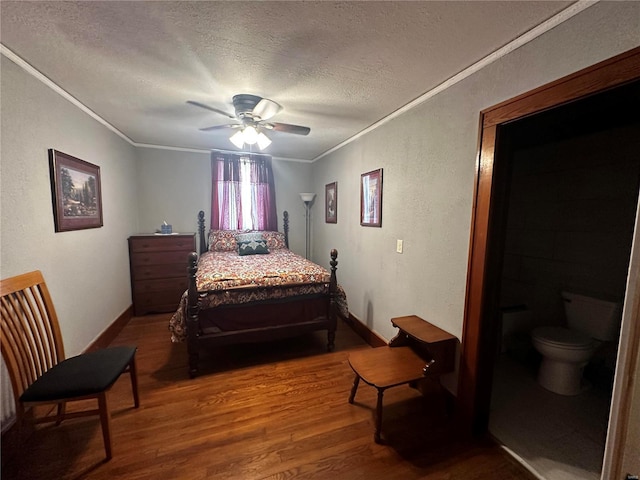 156 S Main St, Ironton, MO 63650 - bedroom featuring crown molding, wood finished floors, a textured ceiling, baseboards, and ceiling fan