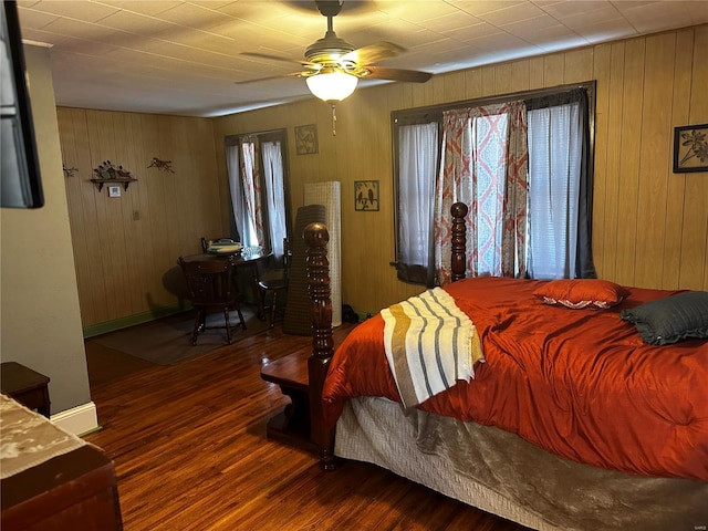 156 S Main St, Ironton, MO 63650 - bedroom featuring wood finished floors, wooden walls, and ceiling fan