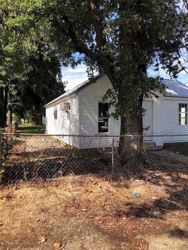 view of side of home featuring a garage