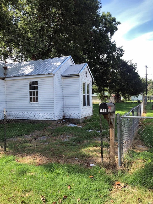 view of home's exterior with metal roof