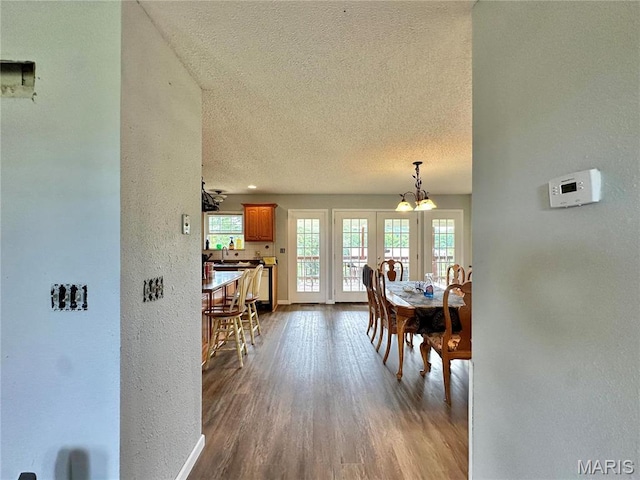 6624 State Route C, Saint Genevieve, MO 63670 - dining room with a textured ceiling, french doors, plenty of natural light, dark wood-style floors, and a textured wall