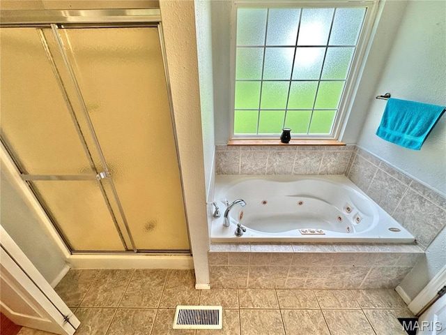 6624 State Route C, Saint Genevieve, MO 63670 - bathroom featuring a shower stall, a tub with jets, and tile patterned flooring