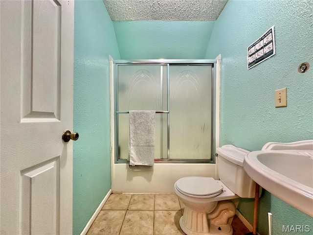 6624 State Route C, Saint Genevieve, MO 63670 - full bathroom with tile patterned flooring, a textured wall, and enclosed tub / shower combo