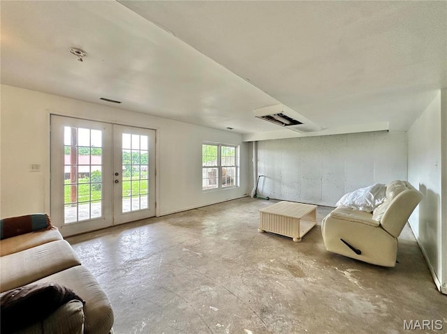 6624 State Route C, Saint Genevieve, MO 63670 - living room featuring unfinished concrete floors and french doors