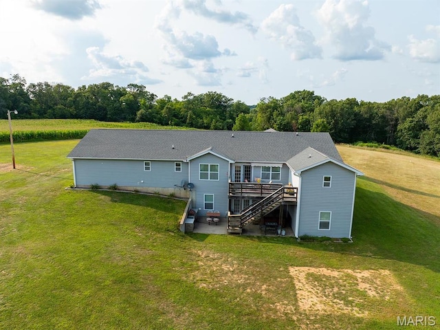 back of property featuring a patio area, a deck, stairway, and a yard