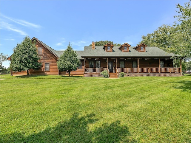view of front facade featuring a front lawn, a chimney, a porch, and roof with shingles