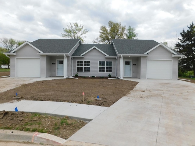 105 Margarita Ct, Centralia, MO 65240 - ranch-style house featuring a garage, concrete driveway, and roof with shingles