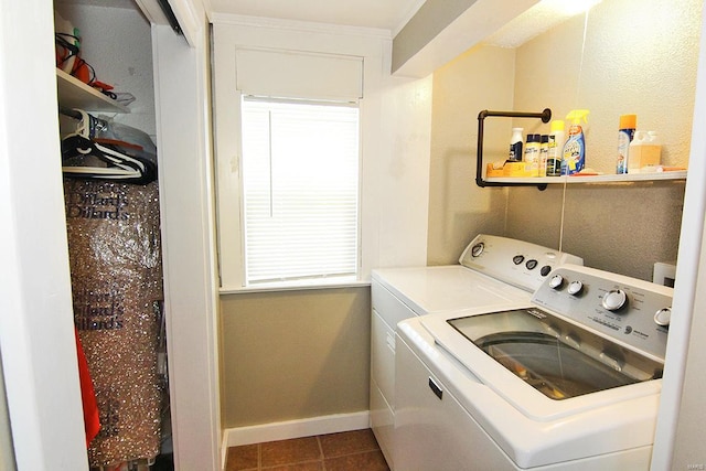 laundry room with independent washer and dryer, plenty of natural light, baseboards, and tile patterned flooring