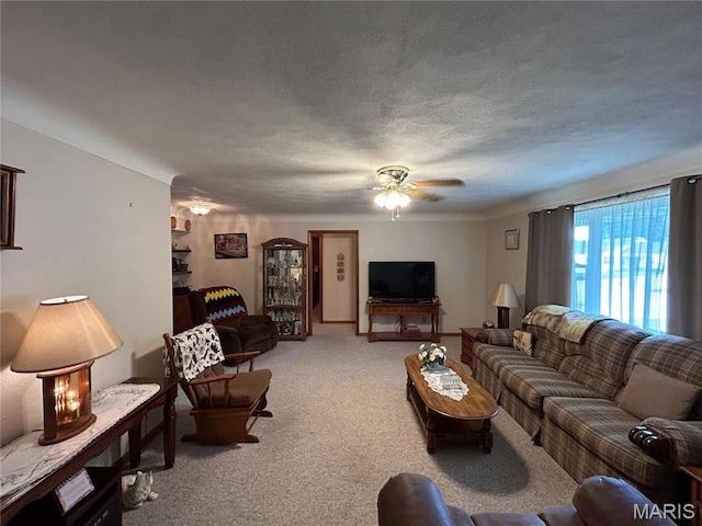 102 W Center St, Salem, MO 65560 - living room featuring light carpet, ceiling fan, and a textured ceiling
