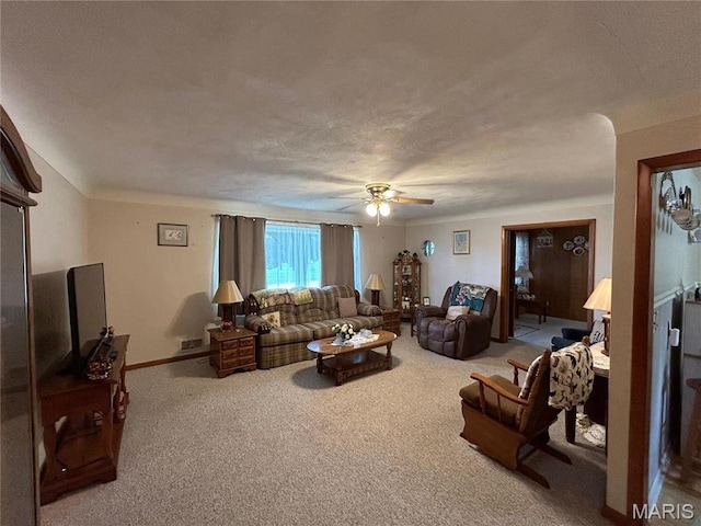 102 W Center St, Salem, MO 65560 - living room with ceiling fan, carpet, a textured ceiling, and baseboards