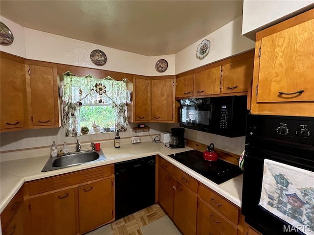 102 W Center St, Salem, MO 65560 - kitchen featuring a sink, black appliances, light countertops, and brown cabinets