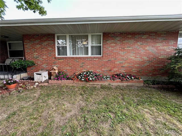 102 W Center St, Salem, MO 65560 - property entrance featuring brick siding and a lawn