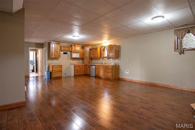 970 Lammert Ln, Union, MO 63084 - kitchen featuring stainless steel dishwasher, a drop ceiling, baseboards, dark wood-style flooring, and light countertops