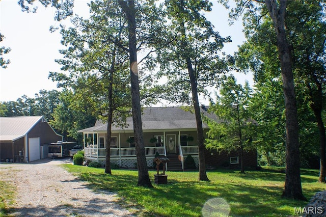 970 Lammert Ln, Union, MO 63084 - ranch-style home with a porch, a front lawn, driveway, a garage, and an outdoor structure
