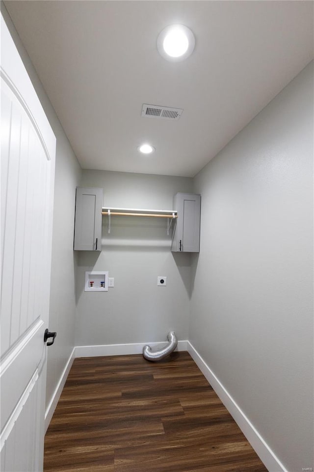 129 Jared St, Waynesville, MO 65583 - laundry area with electric dryer hookup, baseboards, dark wood-type flooring, washer hookup, and cabinet space