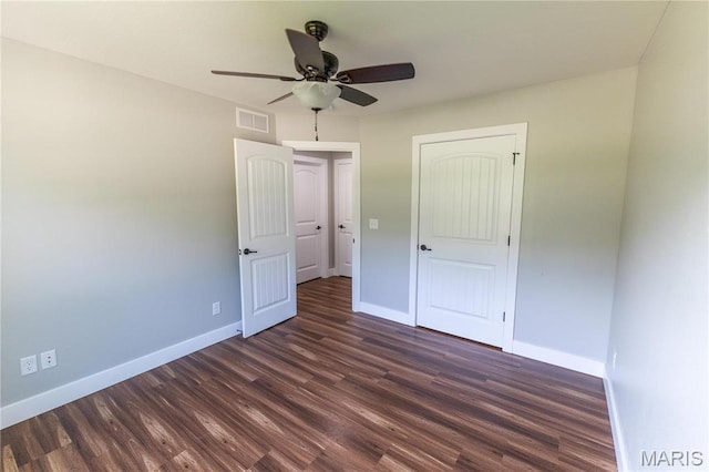 129 Jared St, Waynesville, MO 65583 - unfurnished bedroom with dark wood finished floors and a ceiling fan