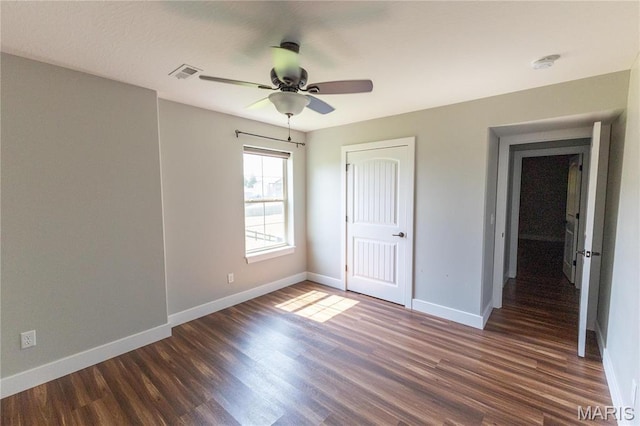 129 Jared St, Waynesville, MO 65583 - unfurnished bedroom featuring dark wood-type flooring, a closet, and ceiling fan