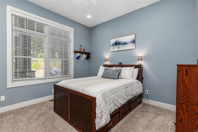 128 Jared St, Waynesville, MO 65583 - bedroom with light colored carpet, baseboards, and a ceiling fan