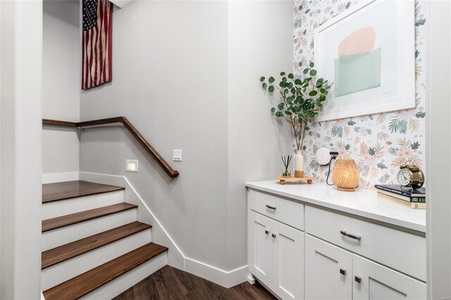 128 Jared St, Waynesville, MO 65583 - stairs featuring baseboards, wood finished floors, and wallpapered walls