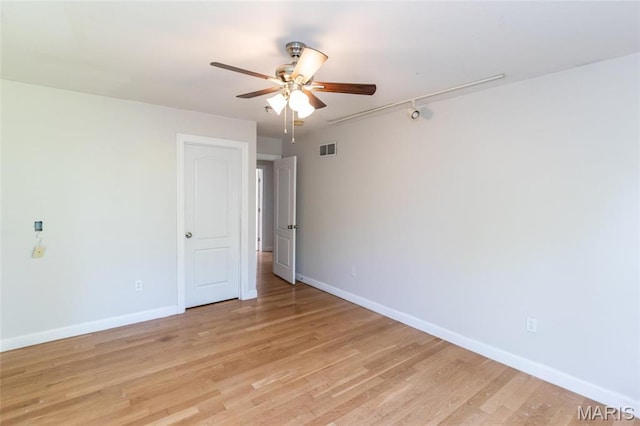 1010 Winter Lake Dr, Fenton, MO 63026 - unfurnished room with ceiling fan, baseboards, and light wood finished floors