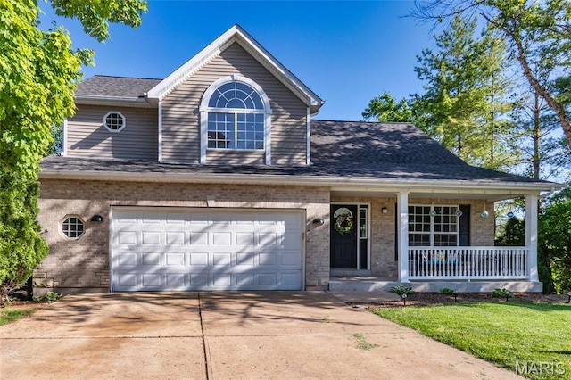 1010 Winter Lake Dr, Fenton, MO 63026 - traditional-style home featuring brick siding, covered porch, concrete driveway, an attached garage, and roof with shingles