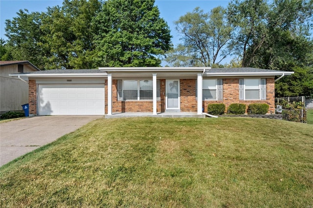 ranch-style house with an attached garage, driveway, and brick siding
